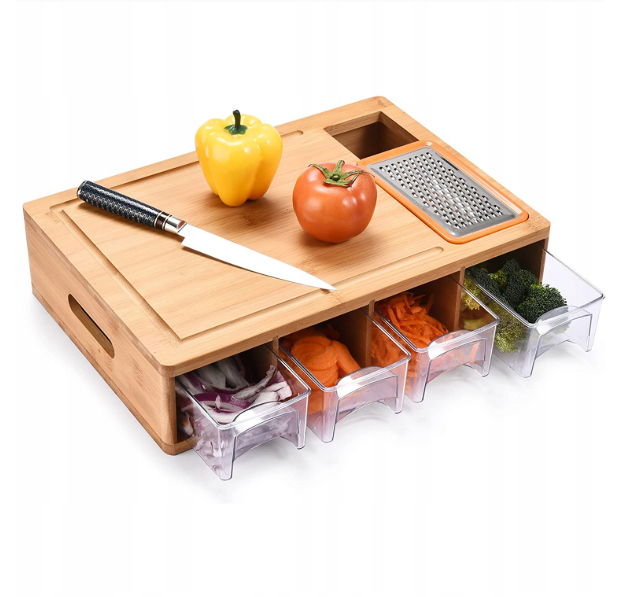 Bamboo cutting board with knife, vegetables, and drawers on a white background